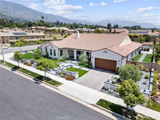 288 Shorey Dr, Glendora, CA 91741 - mediterranean / spanish home featuring a residential view, an attached garage, stucco siding, and driveway