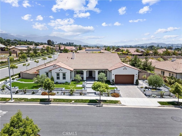 288 Shorey Dr, Glendora, CA 91741 - mediterranean / spanish-style house featuring an attached garage, driveway, a tile roof, a residential view, and a mountain view