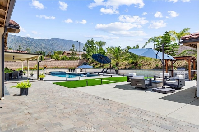 288 Shorey Dr, Glendora, CA 91741 - view of home's community featuring a mountain view, a patio, an outdoor hangout area, exterior kitchen, and a swimming pool