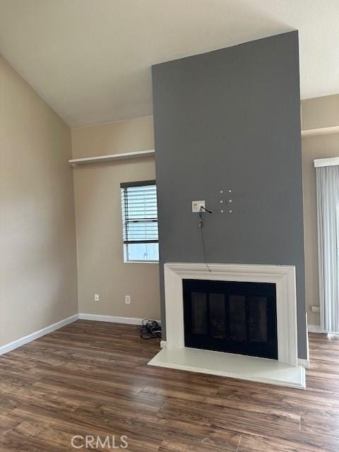 25055 Calle Playa Unit F, Laguna Niguel, CA 92677 - detailed view of baseboards, wood finished floors, and a glass covered fireplace