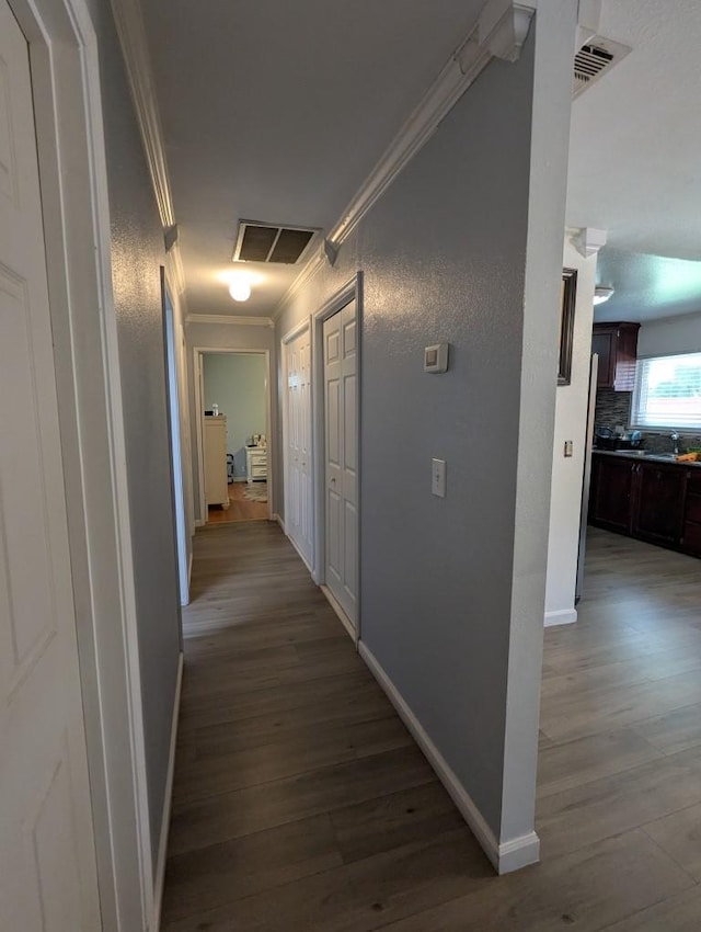 751 Glenwood Ln, Willows, CA 95988 - hallway featuring crown molding, wood finished floors, and baseboards