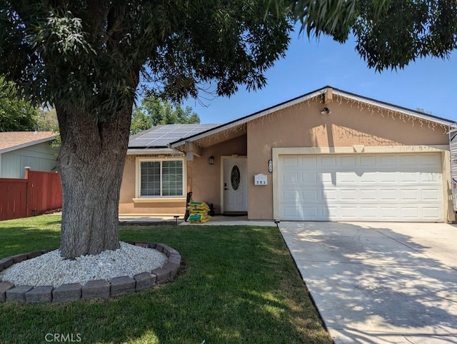 751 Glenwood Ln, Willows, CA 95988 - single story home featuring stucco siding, concrete driveway, a garage, and solar panels