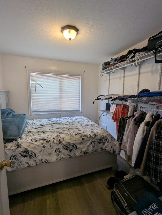 751 Glenwood Ln, Willows, CA 95988 - bedroom with a textured ceiling and wood finished floors