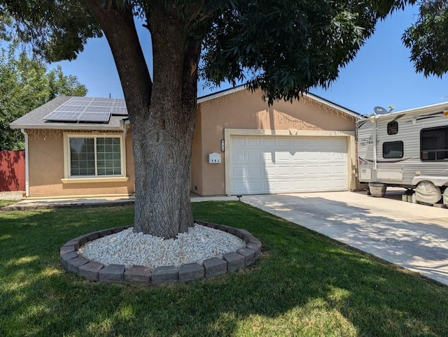751 Glenwood Ln, Willows, CA 95988 - view of front of house with stucco siding, solar panels, a front lawn, driveway, and an attached garage