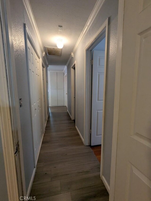 751 Glenwood Ln, Willows, CA 95988 - hallway with crown molding, dark wood-style floors, and baseboards