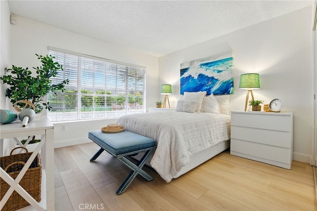 1406 Brett Pl Unit 112, San Pedro, CA 90732 - bedroom featuring light wood finished floors and a textured ceiling