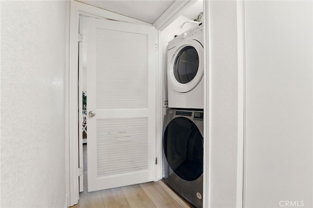 1406 Brett Pl Unit 112, San Pedro, CA 90732 - laundry area with stacked washer / dryer and light wood finished floors