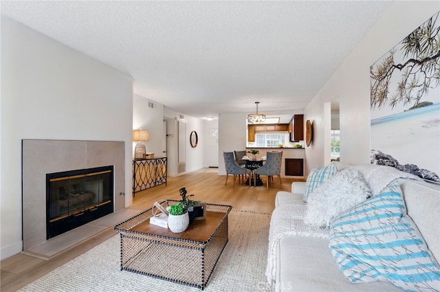 1406 Brett Pl Unit 112, San Pedro, CA 90732 - living room with light wood finished floors and a fireplace