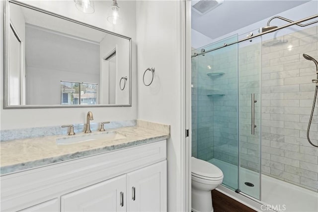 26904 Flo Ln Unit 456, Canyon Country, CA 91351 - full bathroom featuring a stall shower, vanity, toilet, and wood finished floors