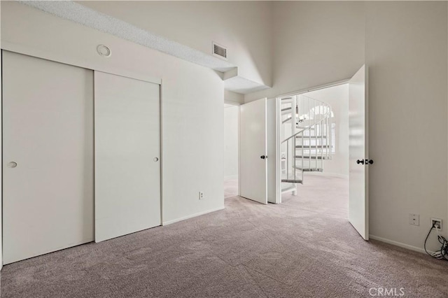 26904 Flo Ln Unit 456, Canyon Country, CA 91351 - unfurnished bedroom with carpet, a closet, a chandelier, and baseboards