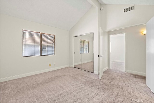 26904 Flo Ln Unit 456, Canyon Country, CA 91351 - unfurnished bedroom featuring high vaulted ceiling, carpet flooring, multiple windows, baseboards, and beam ceiling