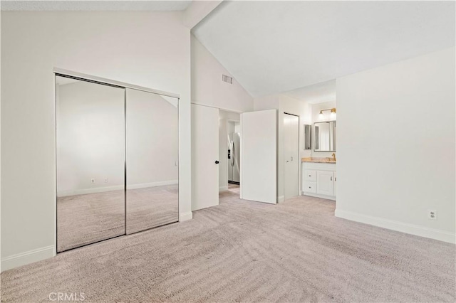 26904 Flo Ln Unit 456, Canyon Country, CA 91351 - unfurnished bedroom with carpet floors, beam ceiling, high vaulted ceiling, baseboards, and ensuite bath