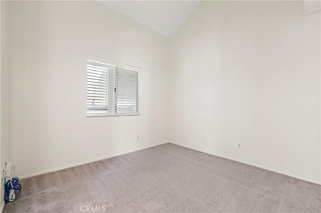26904 Flo Ln Unit 456, Canyon Country, CA 91351 - carpeted spare room with lofted ceiling and baseboards
