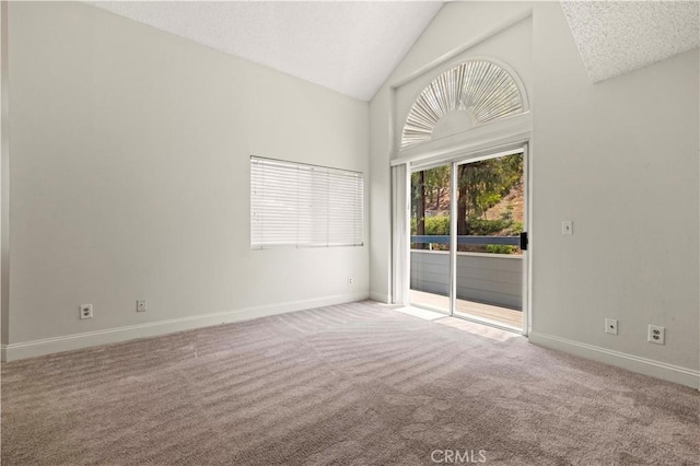 26904 Flo Ln Unit 456, Canyon Country, CA 91351 - carpeted empty room with baseboards and high vaulted ceiling