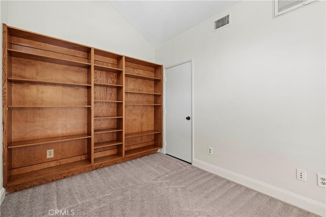 26904 Flo Ln Unit 456, Canyon Country, CA 91351 - carpeted spare room with vaulted ceiling and baseboards