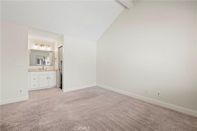 26904 Flo Ln Unit 456, Canyon Country, CA 91351 - unfurnished bedroom featuring light colored carpet, baseboards, a sink, and ensuite bath