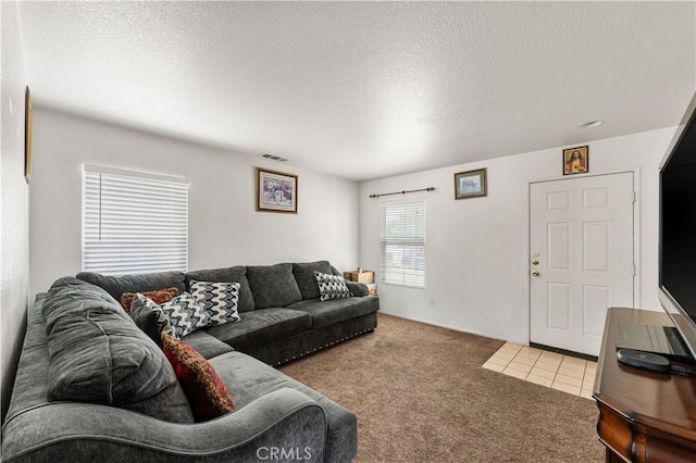 16029 White Mountain Pl, Victorville, CA 92394 - tiled living area featuring carpet flooring and a textured ceiling