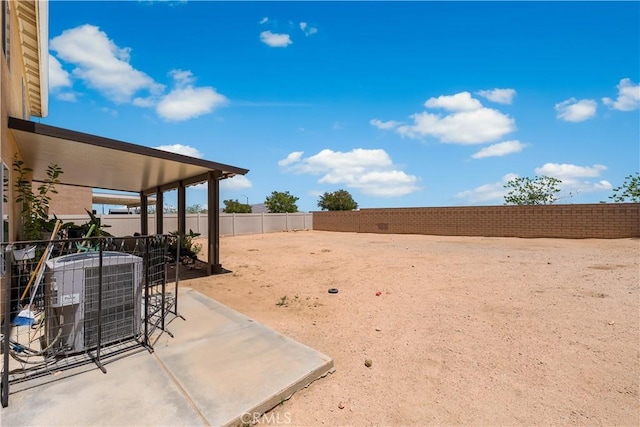 16029 White Mountain Pl, Victorville, CA 92394 - fenced backyard with central air condition unit and a patio
