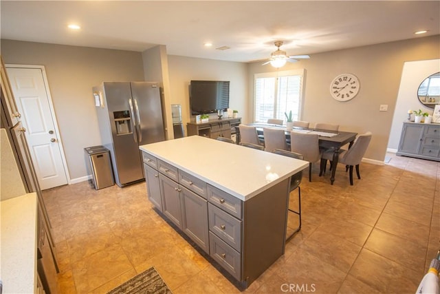 572 Willowgrove Ave, Glendora, CA 91741 - kitchen featuring stainless steel fridge, gray cabinets, a center island, a ceiling fan, and light countertops