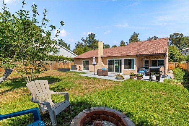 29951 Cactus Pl, Temecula, CA 92592 - rear view of property with an outdoor fire pit, a tile roof, a fenced backyard, a patio, and stucco siding