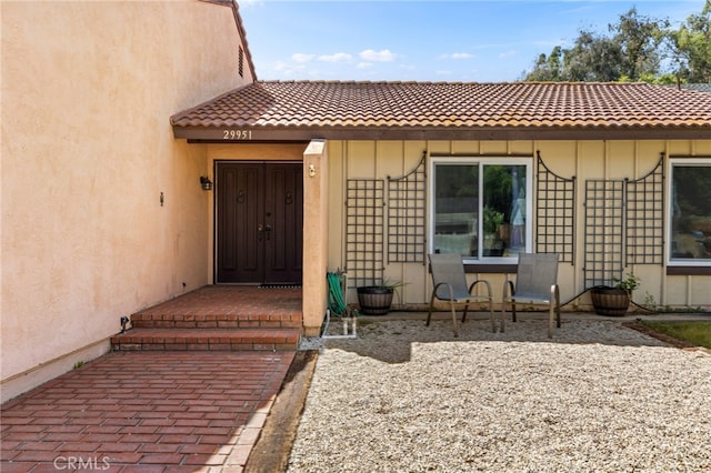 29951 Cactus Pl, Temecula, CA 92592 - property entrance featuring a tile roof and stucco siding