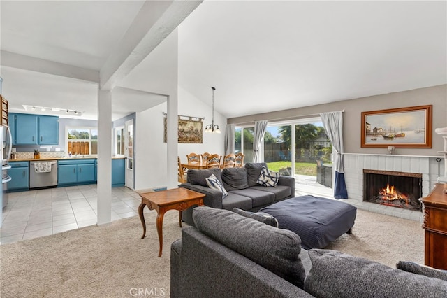 29951 Cactus Pl, Temecula, CA 92592 - living room with light colored carpet, a fireplace, light tile patterned floors, plenty of natural light, and lofted ceiling