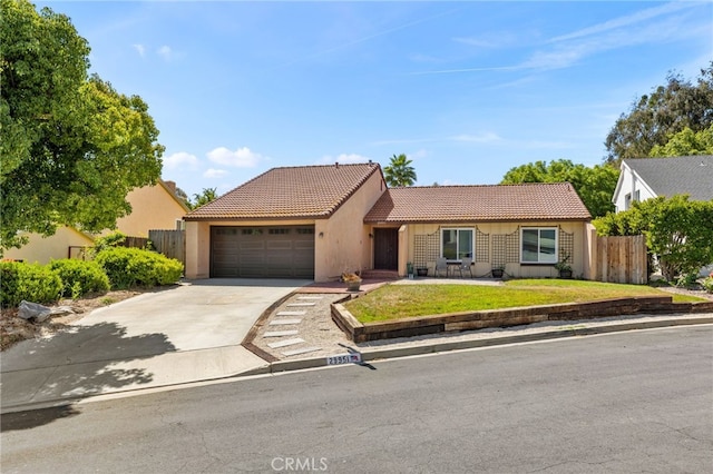29951 Cactus Pl, Temecula, CA 92592 - view of front of home with a tiled roof, concrete driveway, stucco siding, and a garage