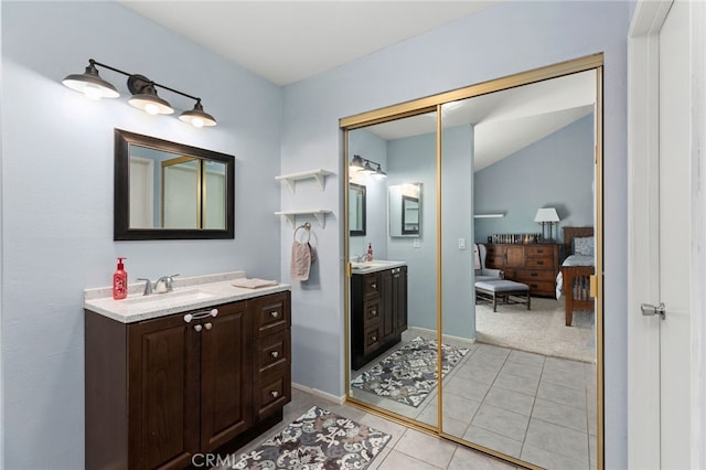 29951 Cactus Pl, Temecula, CA 92592 - full bathroom featuring two vanities, tile patterned floors, ensuite bathroom, and vaulted ceiling