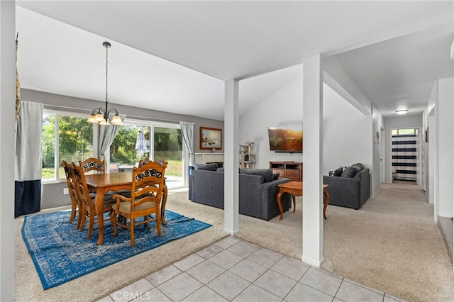 29951 Cactus Pl, Temecula, CA 92592 - dining area with light colored carpet, healthy amount of natural light, a chandelier, light tile patterned flooring, and vaulted ceiling