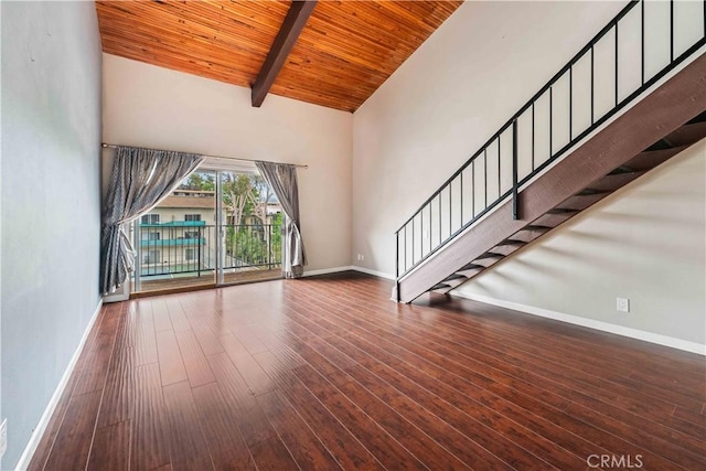 5460 White Oak Ave Unit E339, Encino, CA 91316 - unfurnished living room featuring wood ceiling with exposed beams, baseboards, high vaulted ceiling, wood finished floors, and stairs