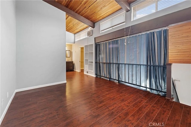 5460 White Oak Ave Unit E339, Encino, CA 91316 - empty room with a high ceiling, wood finished floors, wooden ceiling with exposed beams, and baseboards