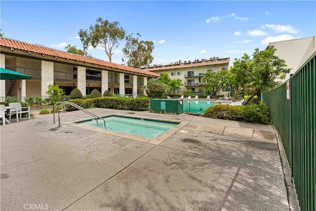5460 White Oak Ave Unit E339, Encino, CA 91316 - view of swimming pool with a hot tub, a patio, and a pool