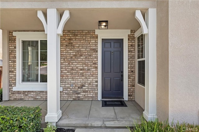 8581 Camino Limon Rd, Corona, CA 92883 - view of exterior entry with a porch and stucco siding