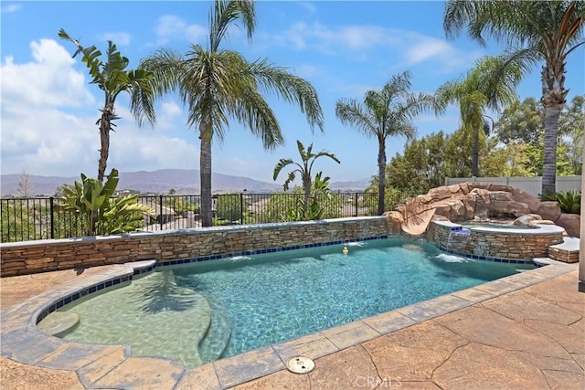 8581 Camino Limon Rd, Corona, CA 92883 - view of pool with a fenced backyard, a mountain view, and a pool with connected hot tub