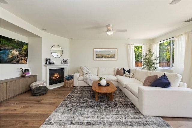 8581 Camino Limon Rd, Corona, CA 92883 - living area with wood finished floors, a glass covered fireplace, and ceiling fan