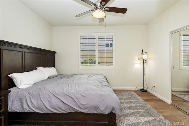 8581 Camino Limon Rd, Corona, CA 92883 - bedroom featuring wood finished floors, baseboards, multiple windows, and ceiling fan