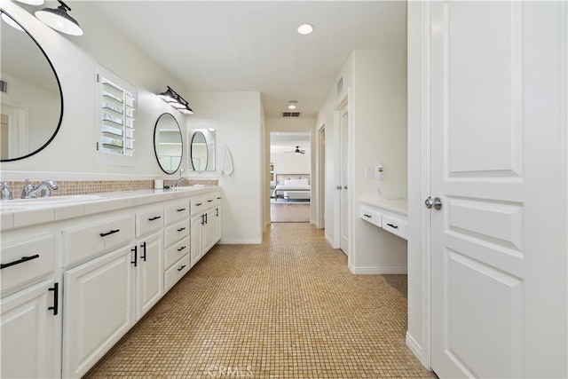 8581 Camino Limon Rd, Corona, CA 92883 - ensuite bathroom with double vanity, baseboards, and recessed lighting