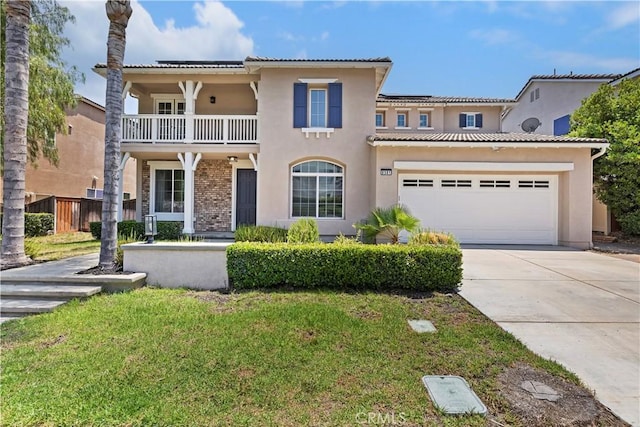8581 Camino Limon Rd, Corona, CA 92883 - mediterranean / spanish-style home with a balcony, driveway, stucco siding, and a front lawn