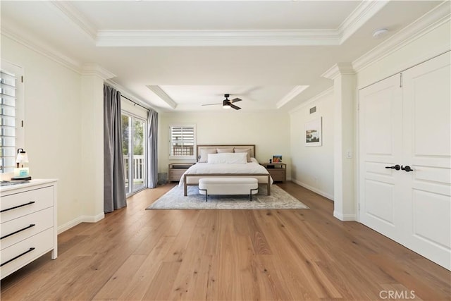 8581 Camino Limon Rd, Corona, CA 92883 - bedroom featuring a tray ceiling, access to exterior, light wood-style flooring, baseboards, and ornamental molding