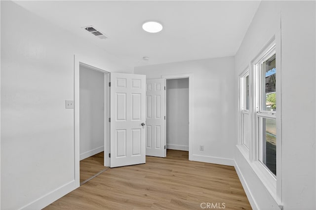 401 Cypress St, Bakersfield, CA 93304 - unfurnished bedroom featuring baseboards and light wood finished floors