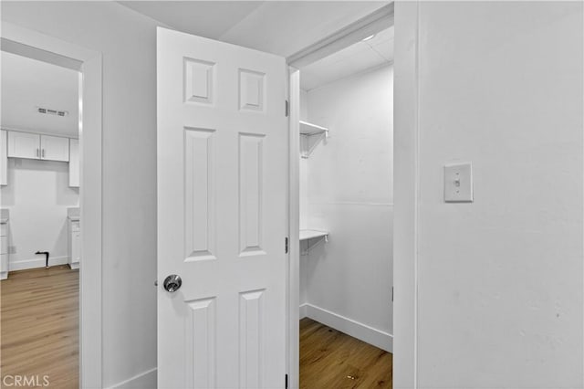 401 Cypress St, Bakersfield, CA 93304 - walk in closet featuring light wood-style floors