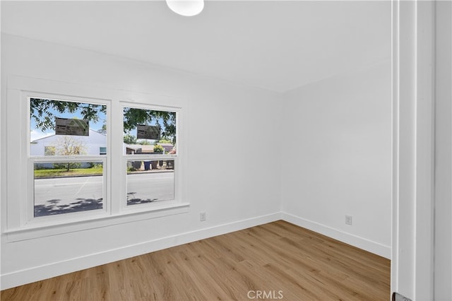 401 Cypress St, Bakersfield, CA 93304 - spare room with light wood-style floors and baseboards