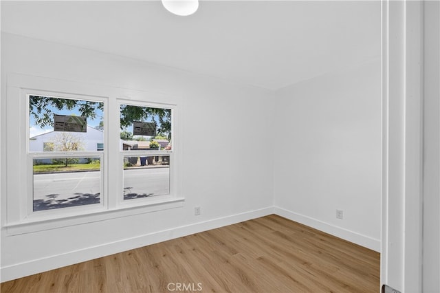401 Cypress St, Bakersfield, CA 93304 - spare room with light wood-type flooring and baseboards