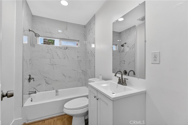 401 Cypress St, Bakersfield, CA 93304 - bathroom featuring vanity, tub / shower combination, wood finished floors, and recessed lighting