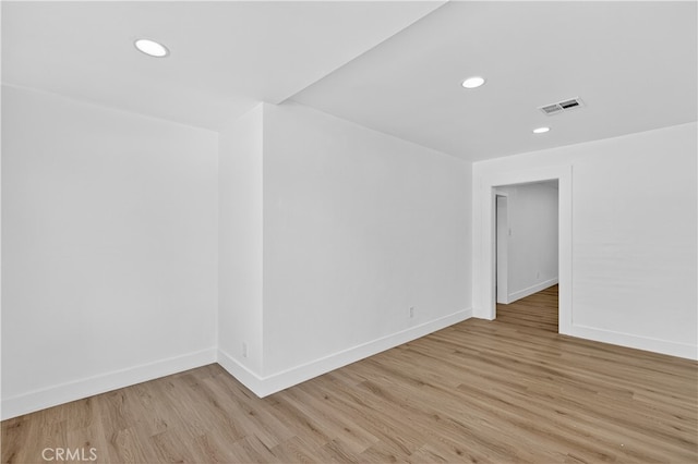 401 Cypress St, Bakersfield, CA 93304 - empty room with light wood-type flooring, baseboards, and recessed lighting