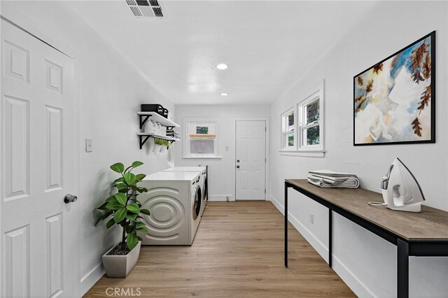 401 Cypress St, Bakersfield, CA 93304 - washroom featuring washer and clothes dryer, light wood finished floors, and recessed lighting