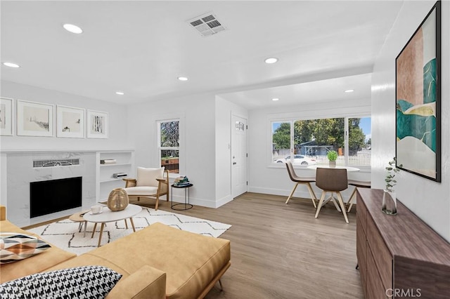 401 Cypress St, Bakersfield, CA 93304 - living area featuring recessed lighting, light wood finished floors, and a premium fireplace