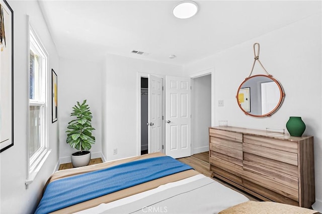 401 Cypress St, Bakersfield, CA 93304 - bedroom featuring wood finished floors and baseboards
