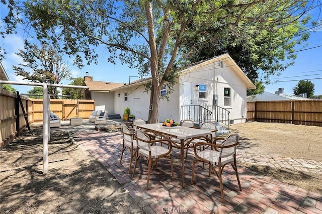 401 Cypress St, Bakersfield, CA 93304 - fenced backyard with a patio and outdoor dining space