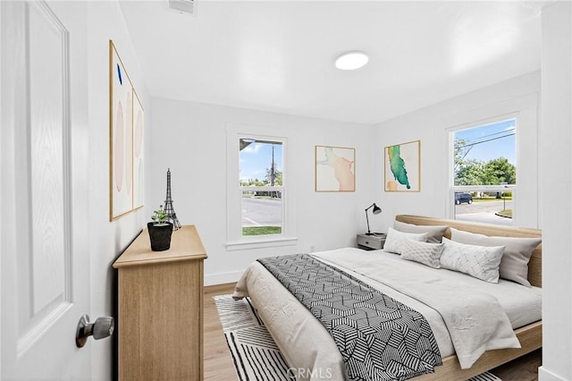 401 Cypress St, Bakersfield, CA 93304 - bedroom featuring wood finished floors and baseboards